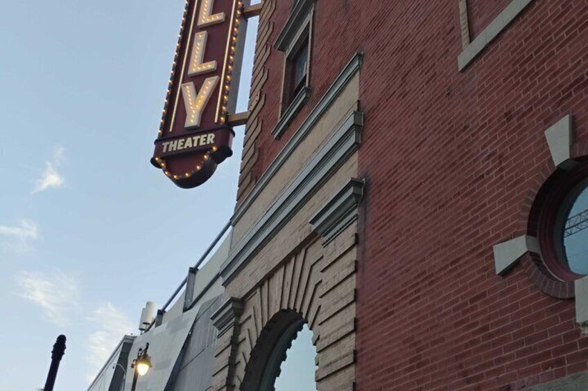 A theater marquee with 'THEATER' written on it. 5