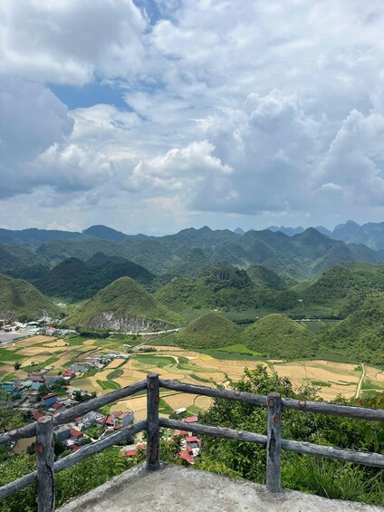 A mountainous landscape with terraced fields and a small village. 3