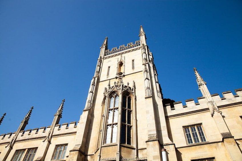 A tall, ornate building with a pointed roof and large windows. 4
