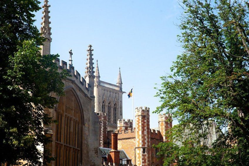 A historic building with Gothic architecture, including pointed arches and a large wooden door. 2
