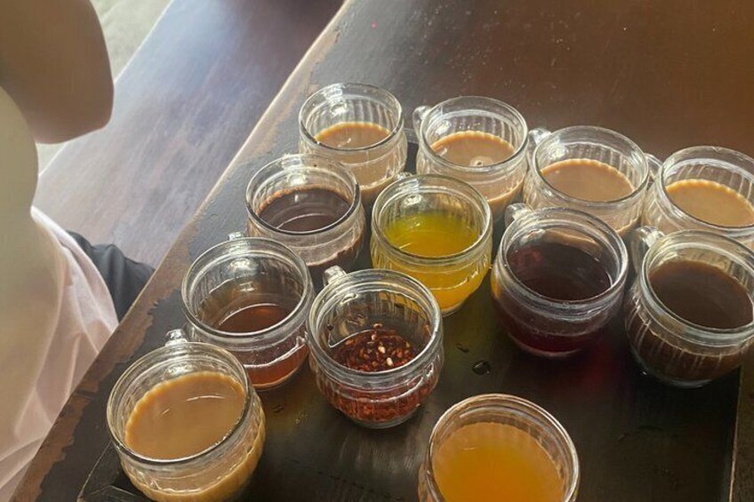 A tray with various small glass containers holding different colored liquids. 2