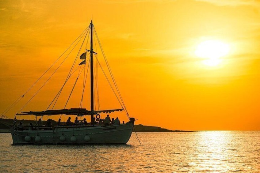 A sailboat on calm waters during sunset. 2