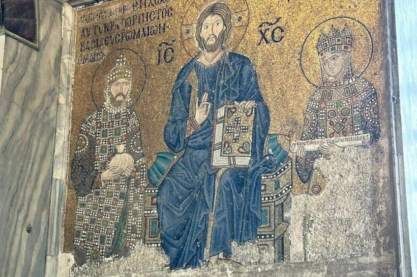 A mosaic with three figures, one seated and two standing, in a historical setting. 3
