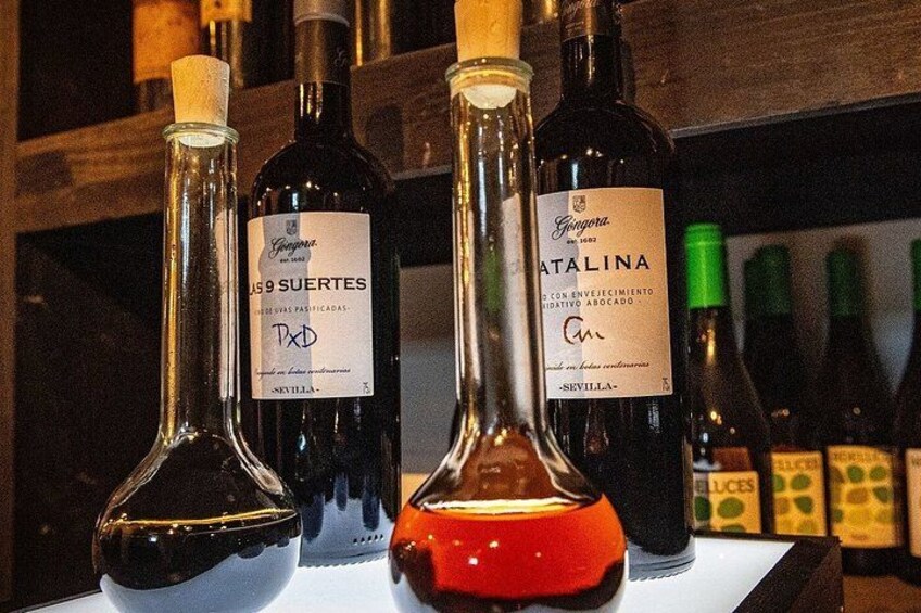 Three wine bottles with labels, one of which is 'Natalina'. 3