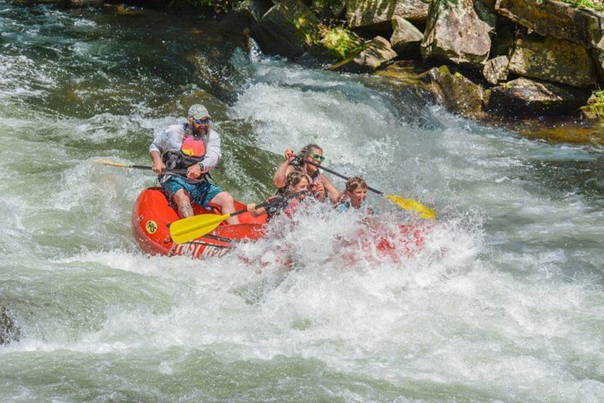 A group of people rafting on a river. 2