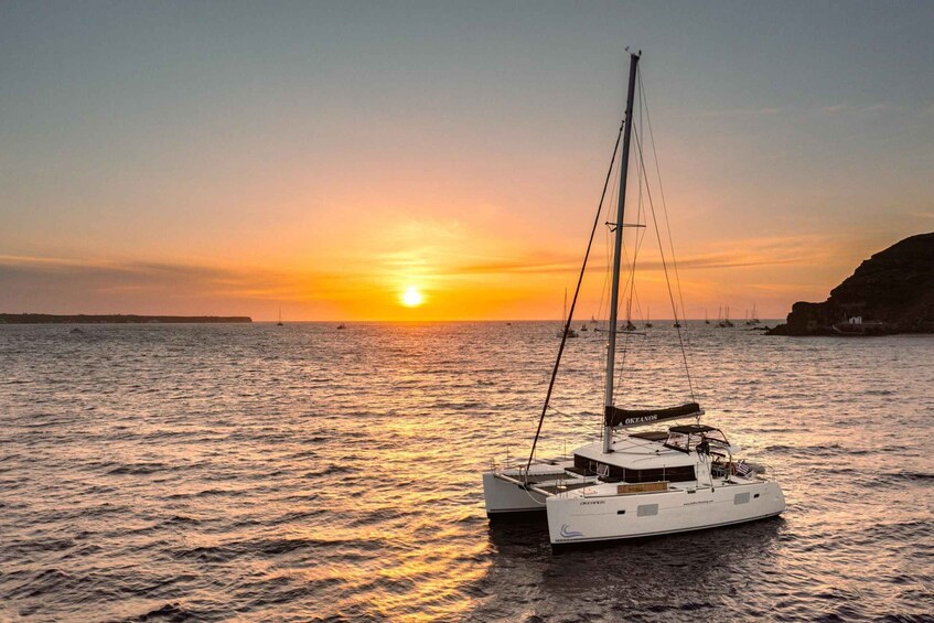 A sailboat on calm waters during sunset. 3