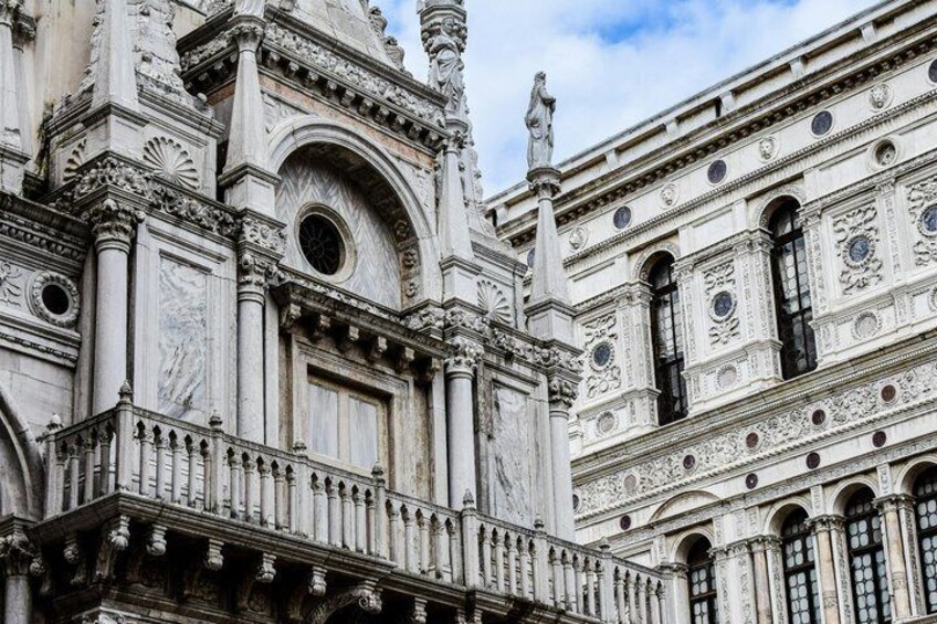 A detailed facade of a historic building with ornate sculptures, columns, and intricate architectural designs. 5
