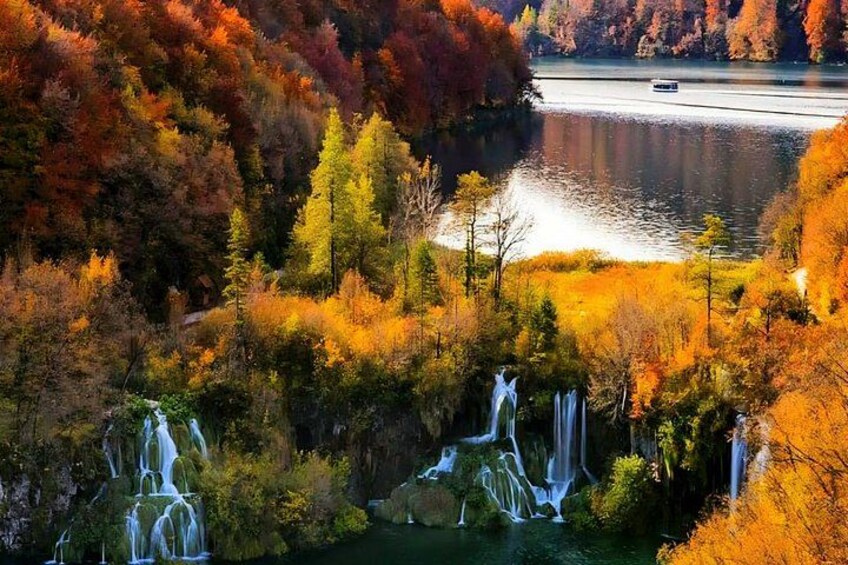 A waterfall surrounded by autumn foliage. 5