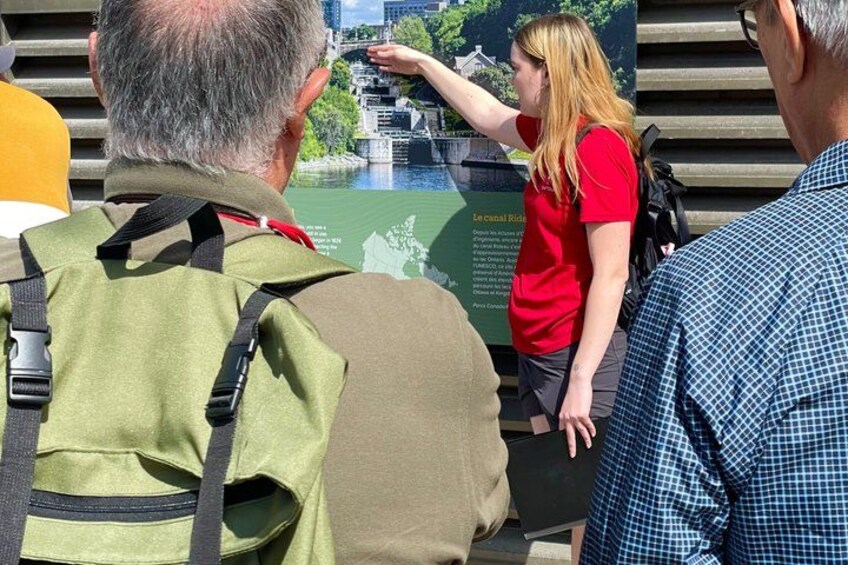 A person pointing at a map or informational display. 1
