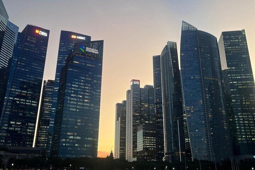 A cityscape with modern skyscrapers, including visible logos of DBS and HSBC. 4