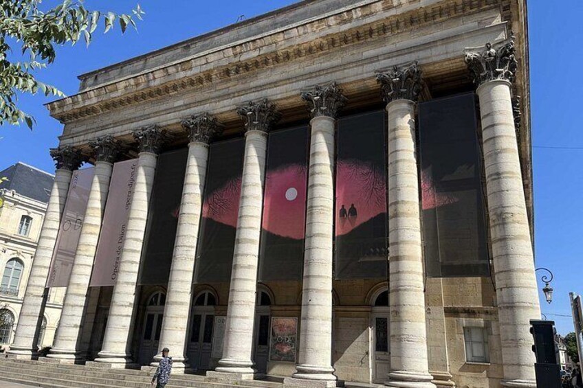 A classical building with large columns and a prominent entrance. 5