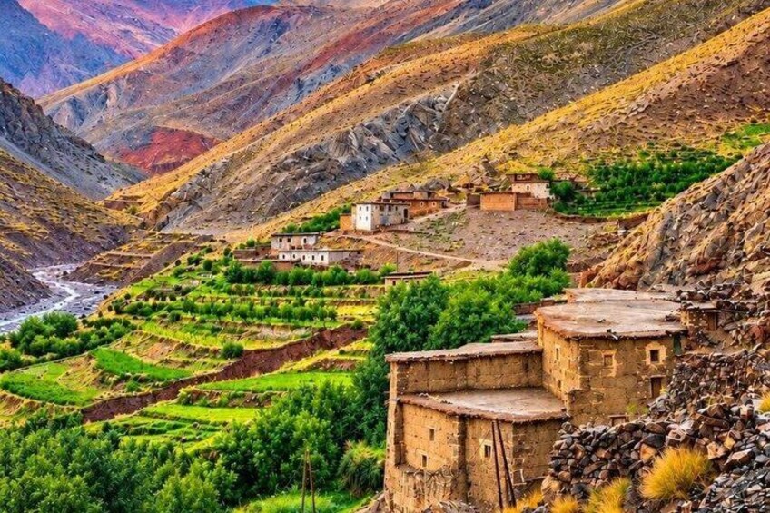 Terraced agricultural fields, traditional buildings, and a mountainous landscape. 5