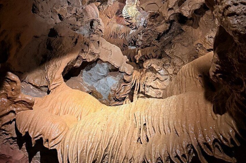 A cave with stalactites and stalagmites. 2