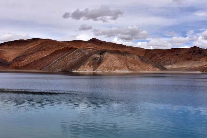 A lake surrounded by mountains. 5
