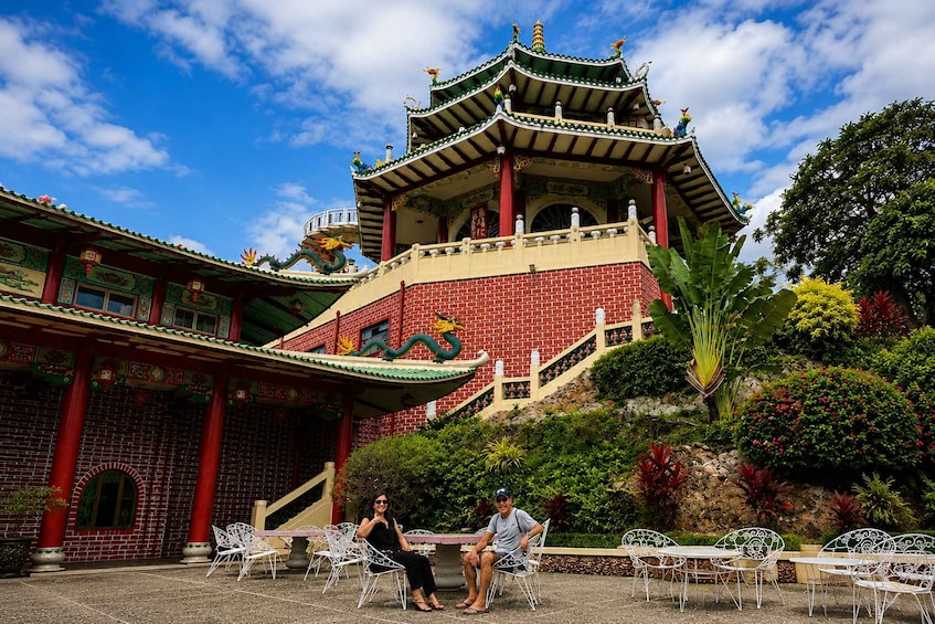 A traditional Chinese pagoda with intricate roof designs and a red brick facade. 3