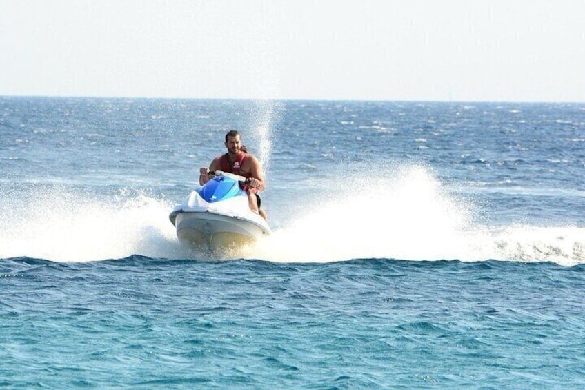 A person jet-skiing on a body of water. 4