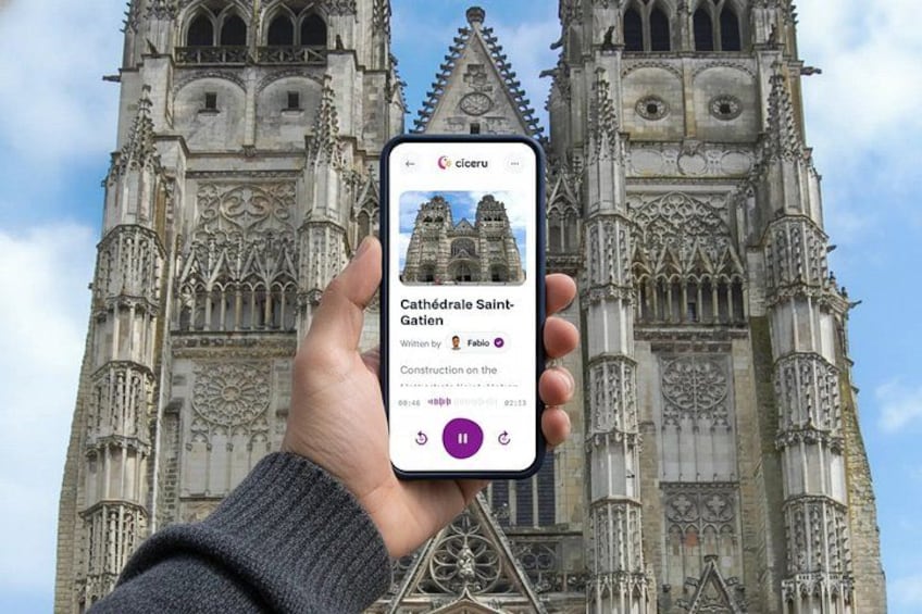 A hand holding a smartphone displaying a cathedral with intricate architecture. 1