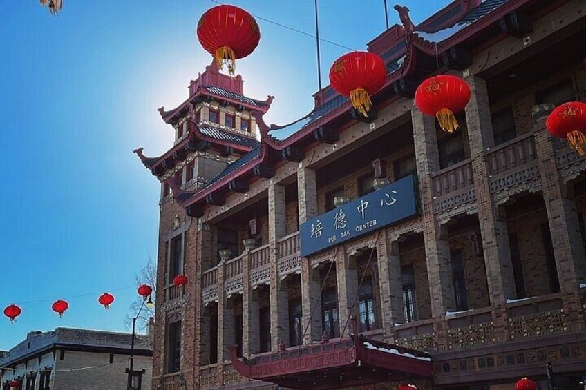 A traditional building with a sign that reads 'PUI TAX CENTER'. 5