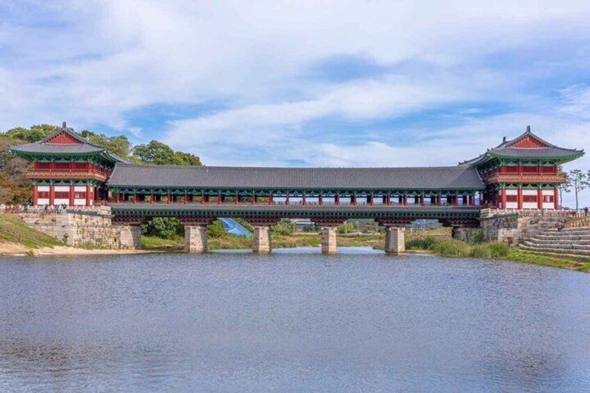 A traditional Korean bridge with a pavilion on each end, spanning a body of water. 3