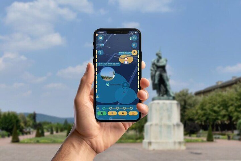 A hand holding a smartphone with a map application, a statue, and a clear sky in the background. 4
