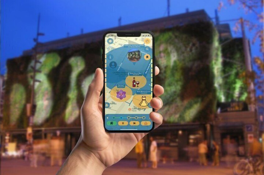 A hand holding a smartphone displaying a map with various points of interest. 2