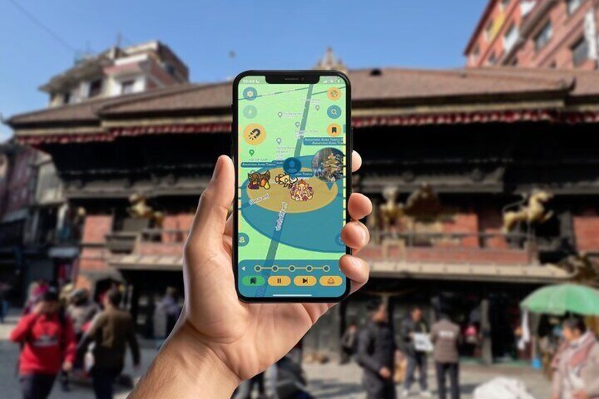 A hand holding a smartphone displaying a map with a location pin, in front of a building with traditional architecture. 1