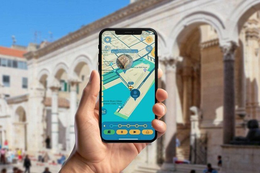 A hand holding a smartphone displaying a map with a location pin, set against a backdrop of classical architecture. 1