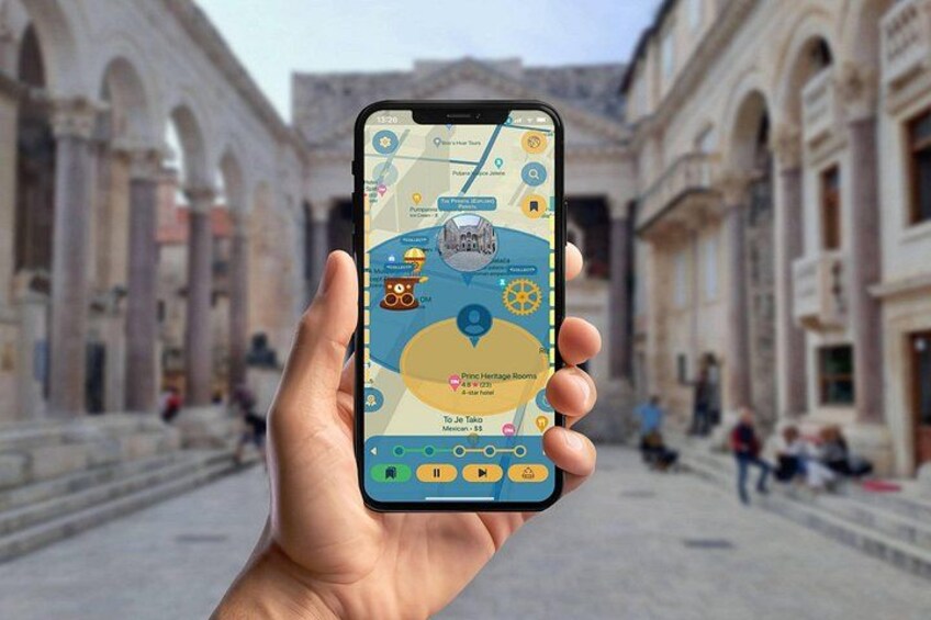 A hand holding a smartphone displaying a map with a location pin, a compass, and a route. 5