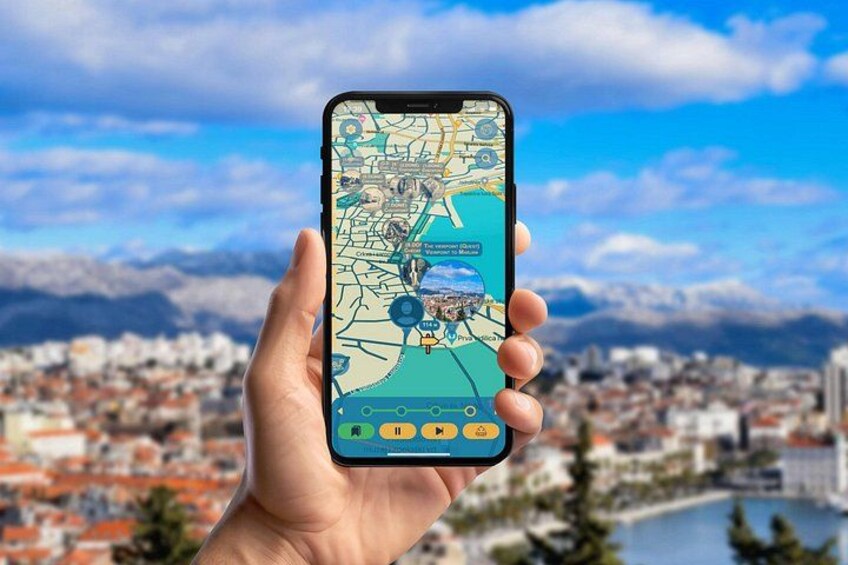 A hand holding a smartphone displaying a map with a cityscape in the background. 2