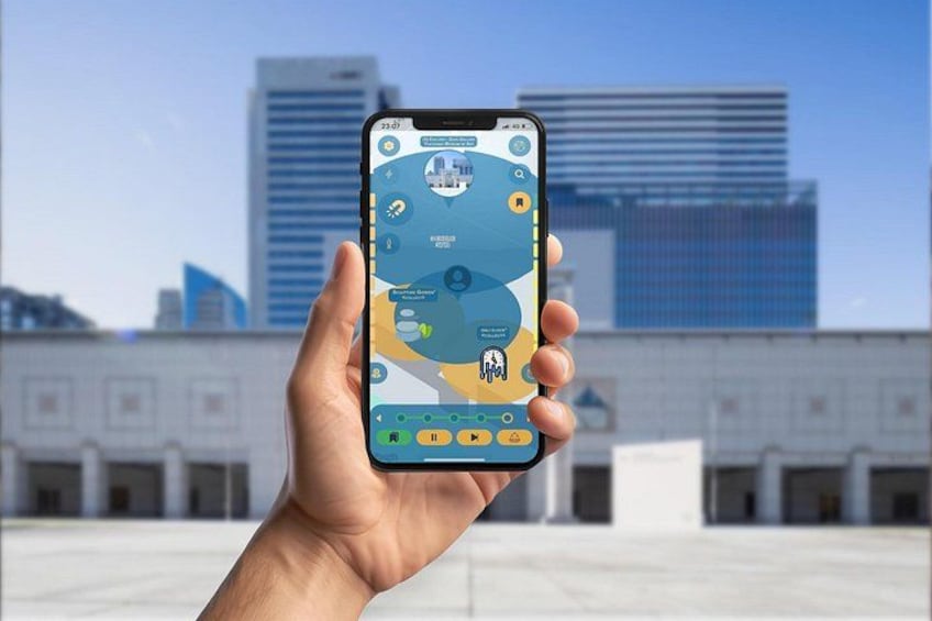 A hand holding a smartphone displaying a map application with various icons and a cityscape in the background. 4