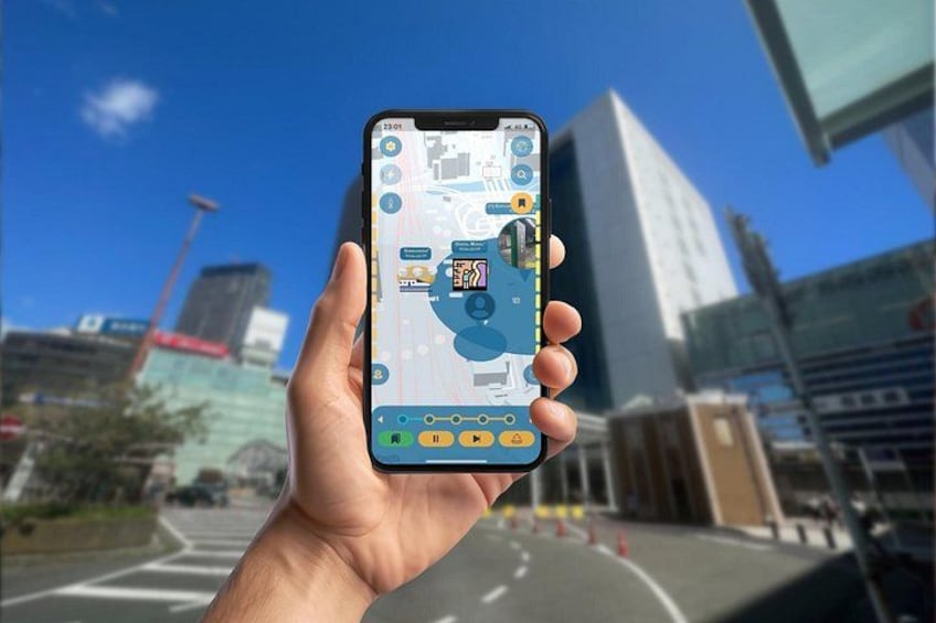A hand holding a smartphone displaying a map with a location pin, buildings, and a road in the background. 1