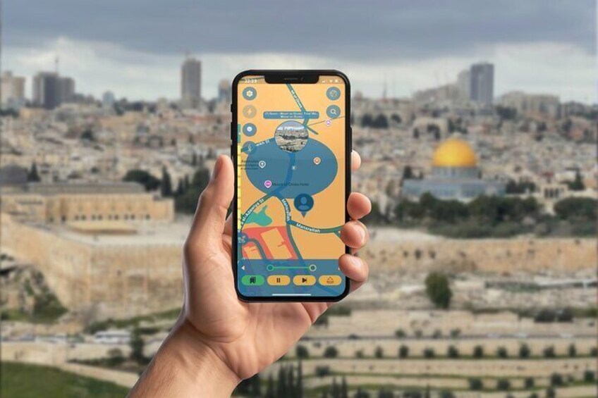 A hand holding a smartphone with a map application, displaying a cityscape with a prominent dome structure in the background. 1