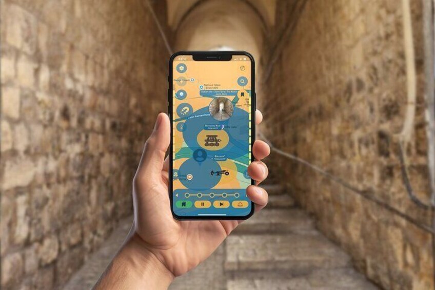 A hand holding a smartphone displaying a map with a central icon, surrounded by a tunnel with stone walls. 5