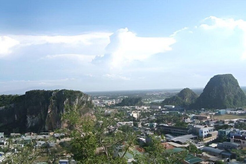 A coastal cityscape with prominent cliffs and a clear sky. 4