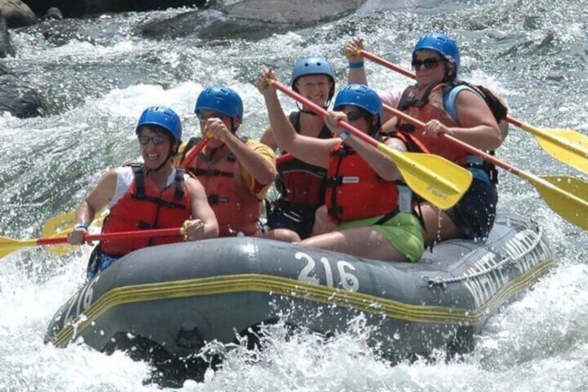 A group of people rafting on a river. 4