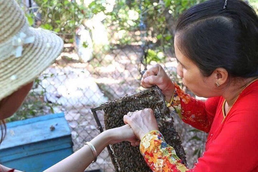 A person in a red shirt holding a woven basket. 4