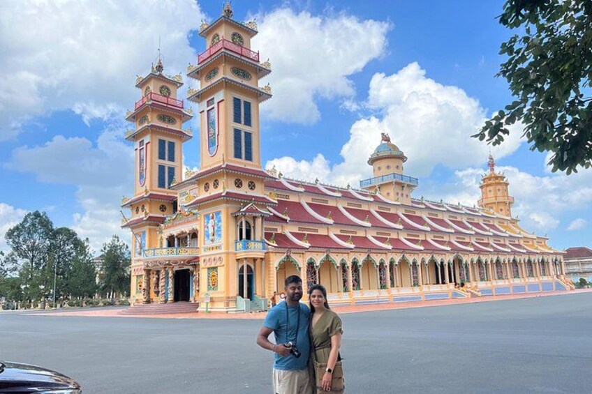 A large, ornate building with multiple towers and a red roof. 5