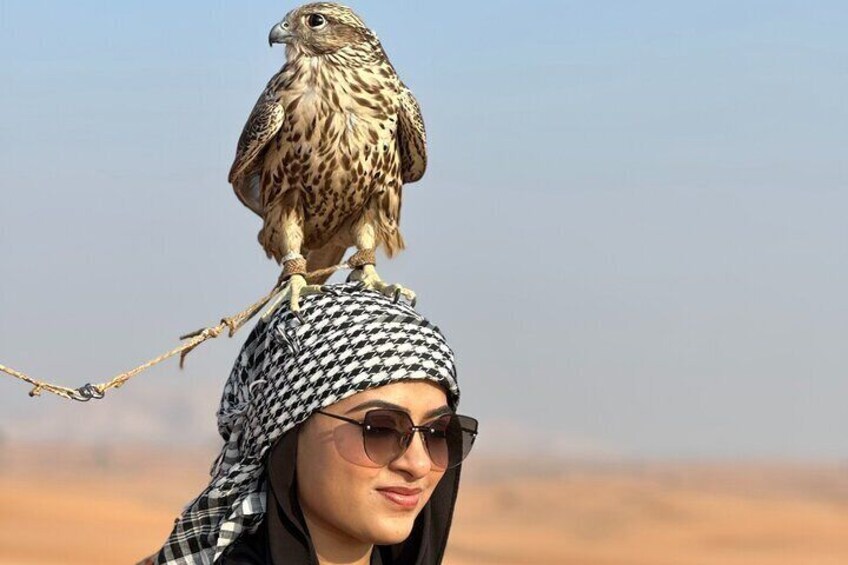 A person with a bird perched on their head. 5