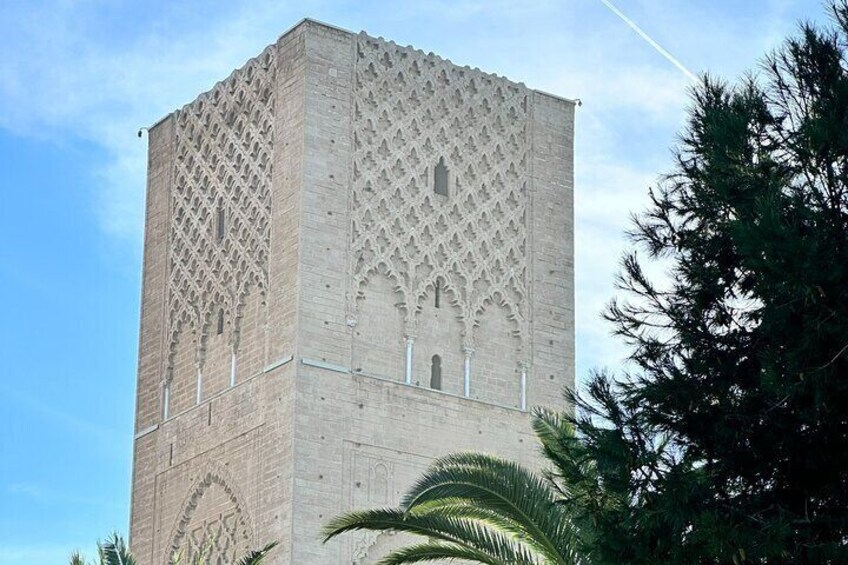 A tall, square tower with intricate latticework and arched windows. 4