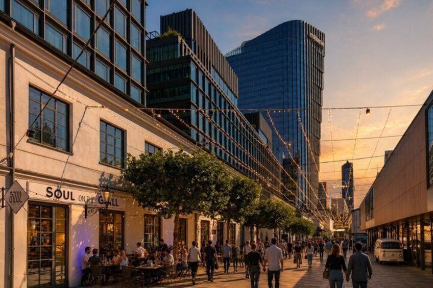 A busy urban street with people walking, a restaurant named 'Soul on the Grill,' and modern buildings. 4