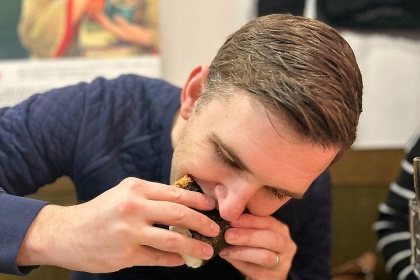 A person eating a sandwich. 3