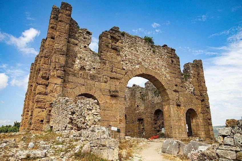 Ancient stone ruins with arches and walls. 4