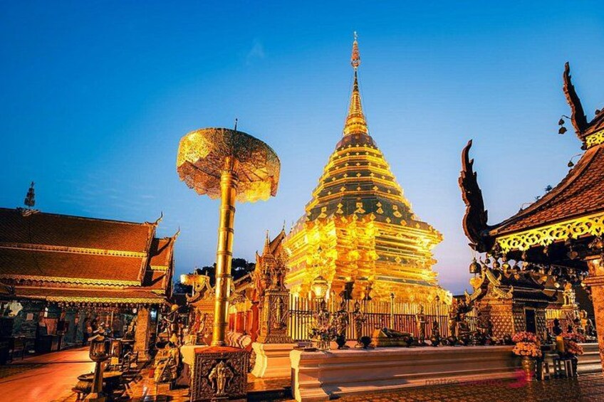 A temple with a golden spire and intricate architecture. 3