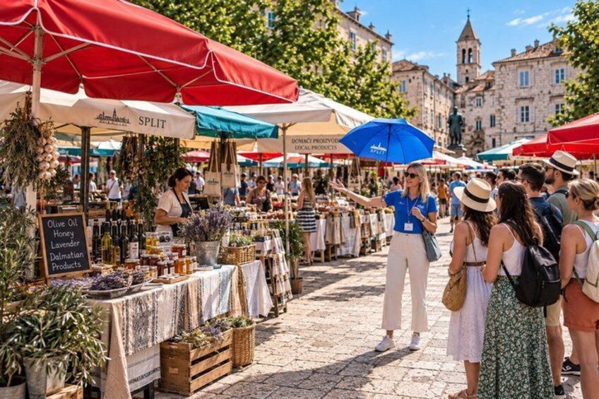 A bustling outdoor market with red and blue umbrellas, various stalls, and people browsing. 3