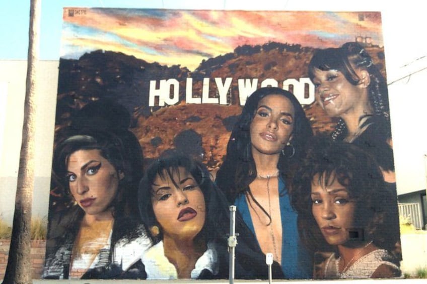 A poster with the text 'HOLLYWOOD' and a mountainous landscape in the background. 4