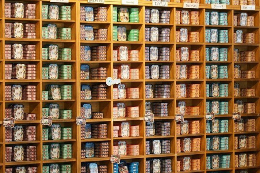 A wall of shelves with various patterned boxes. 4