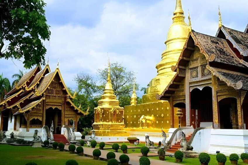 A temple complex with golden spires and traditional architecture. 2