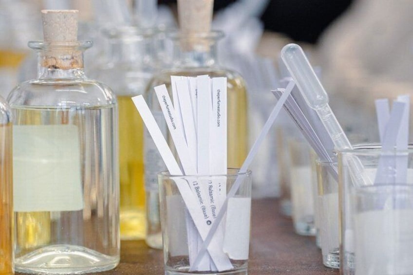 A laboratory setting with glass bottles and test tubes. 4
