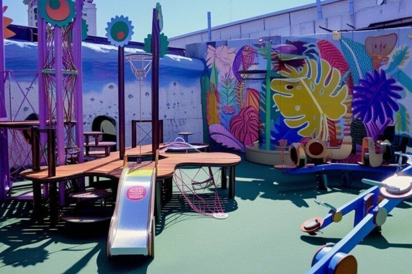 A colorful playground with slides and climbing structures. 3