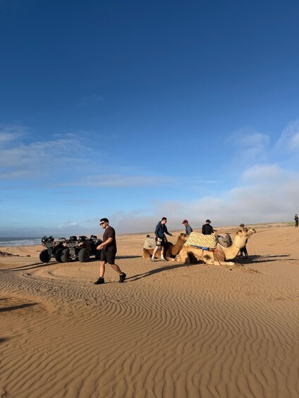 A desert landscape with sand dunes and a clear sky. 2